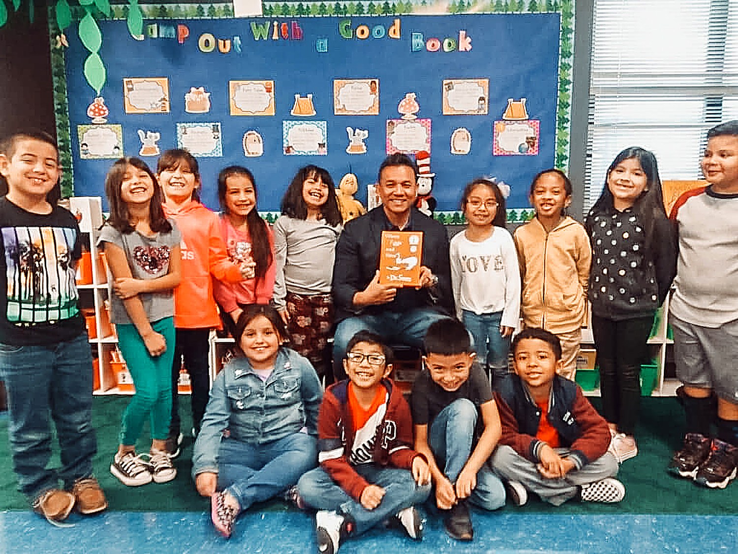 Willie Ng reading with elementary students in a South Texas classroom